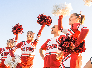 College students walking together and smiling.